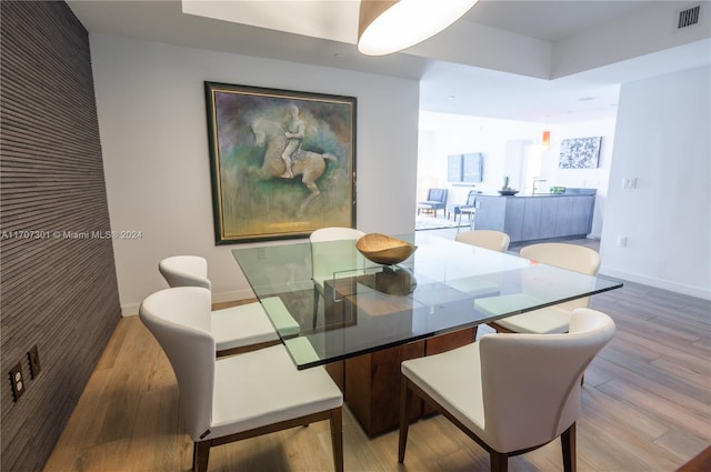 dining room with light hardwood / wood-style flooring