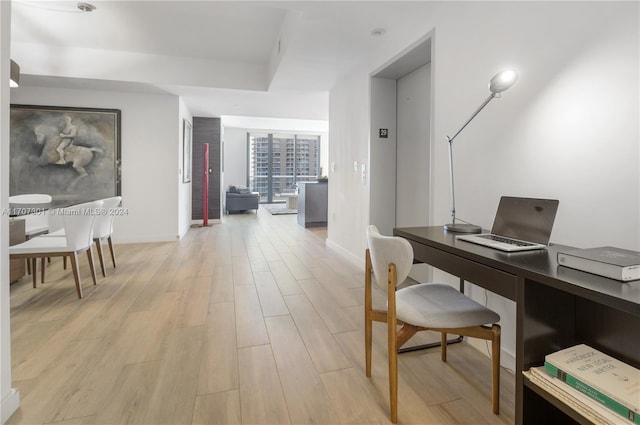 office space with light wood-type flooring