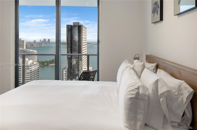 bedroom featuring a water view