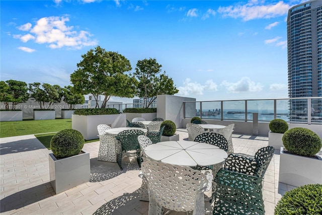 view of patio / terrace with a water view