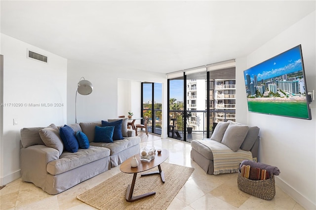 living room featuring floor to ceiling windows