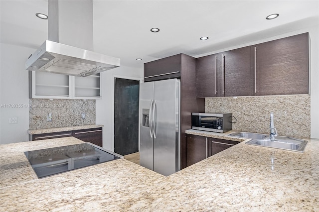 kitchen featuring island exhaust hood, decorative backsplash, dark brown cabinetry, stainless steel appliances, and sink