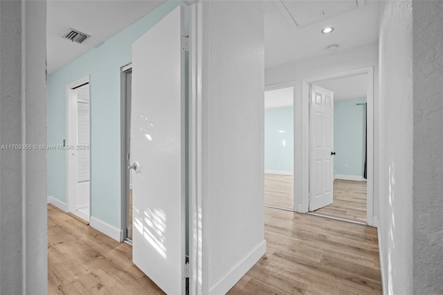 hallway featuring light wood-type flooring