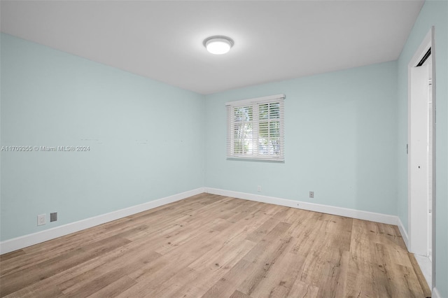 unfurnished room featuring light hardwood / wood-style floors