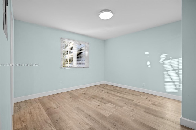 unfurnished room featuring light wood-type flooring