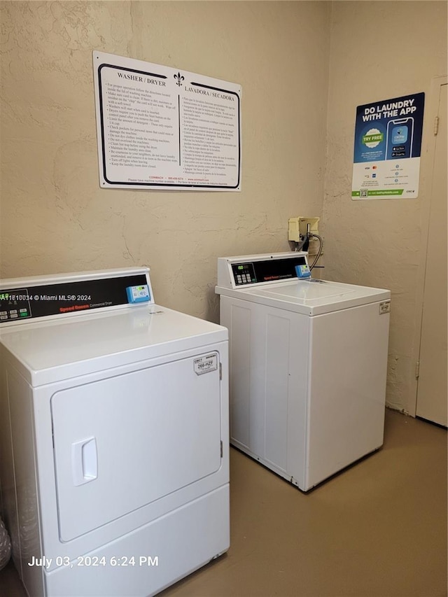 clothes washing area featuring washer and dryer