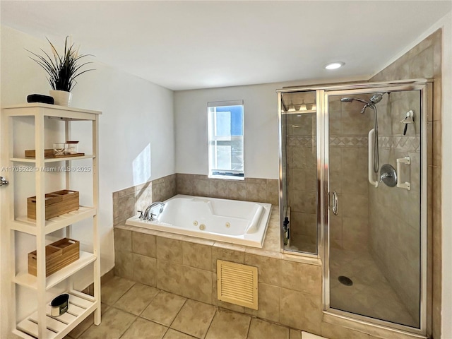 bathroom featuring a shower stall, visible vents, a tub with jets, and tile patterned flooring