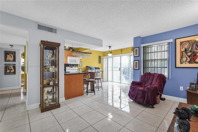 tiled living room with a textured ceiling