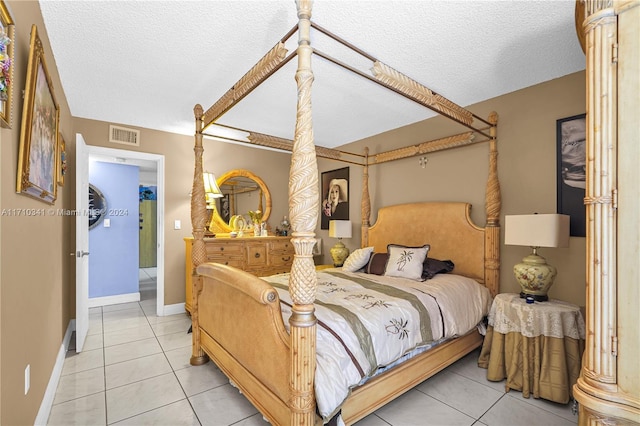 tiled bedroom with a textured ceiling