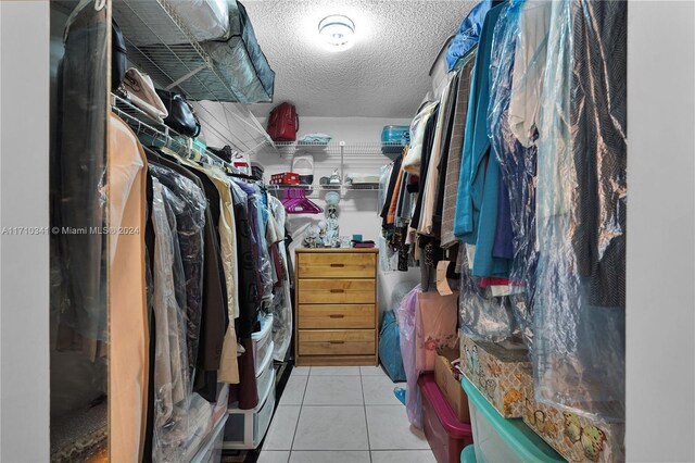 spacious closet featuring light tile patterned flooring