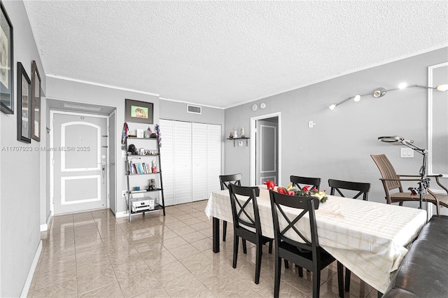 dining room with a textured ceiling