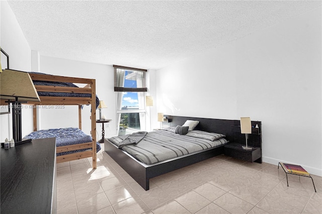 bedroom featuring a textured ceiling