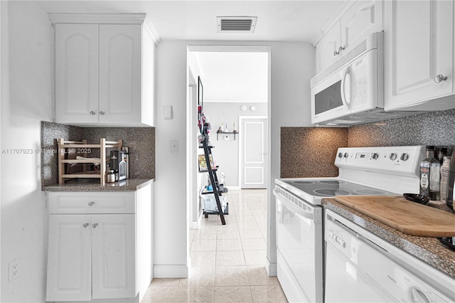 kitchen with white cabinetry, white appliances, light tile patterned flooring, and tasteful backsplash