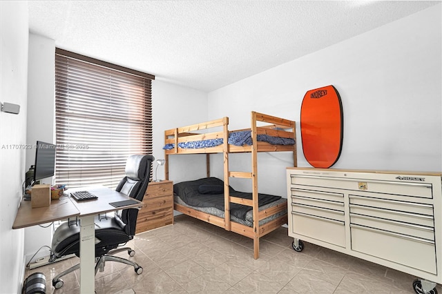 bedroom featuring a textured ceiling