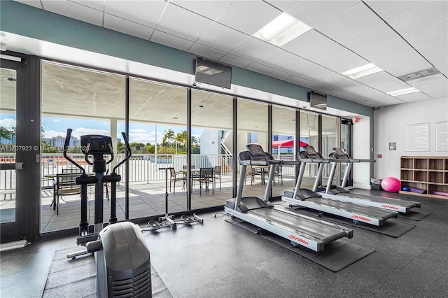 workout area with a drop ceiling