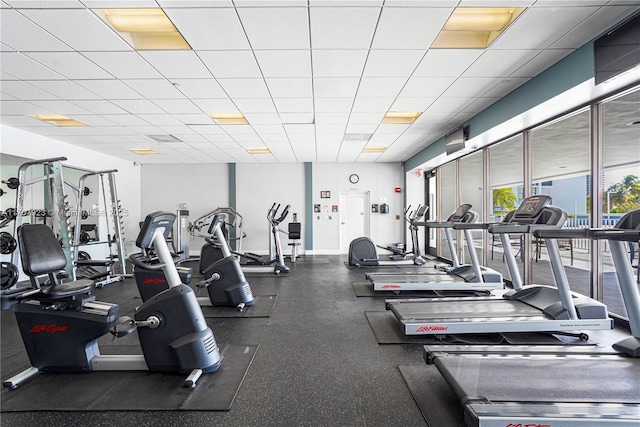 exercise room featuring a drop ceiling