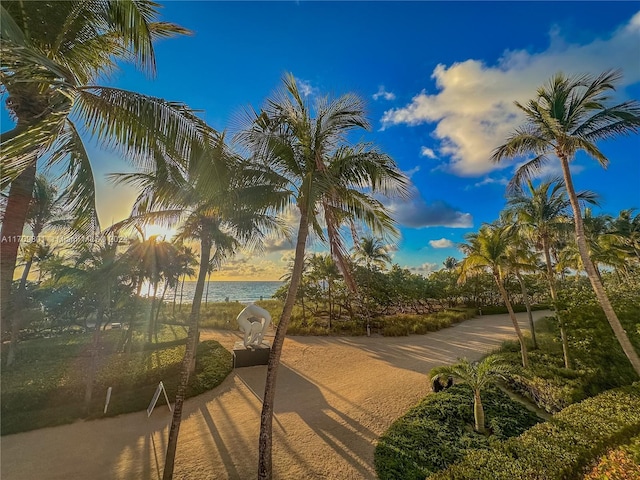 surrounding community featuring a water view