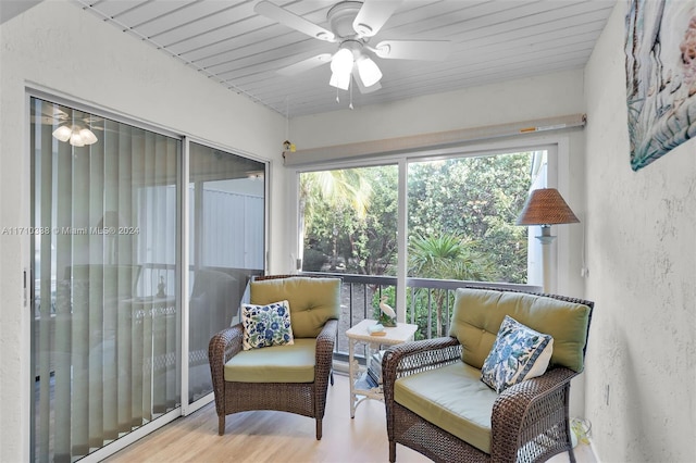 sunroom / solarium featuring ceiling fan