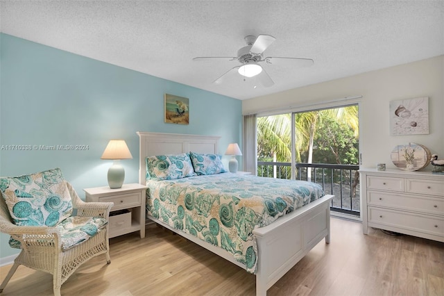 bedroom featuring ceiling fan, light wood-type flooring, a textured ceiling, and access to outside