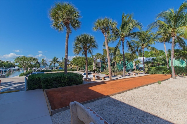 surrounding community featuring a water view