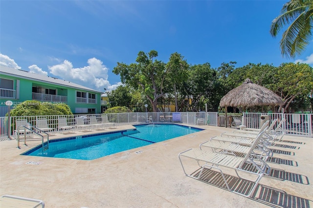 view of swimming pool with a gazebo and a patio area