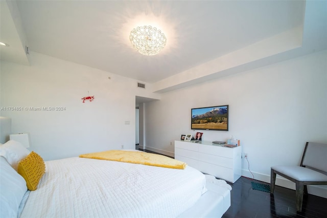 bedroom with dark wood-type flooring