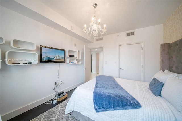 bedroom featuring an inviting chandelier