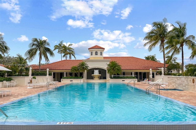 view of swimming pool with a patio area