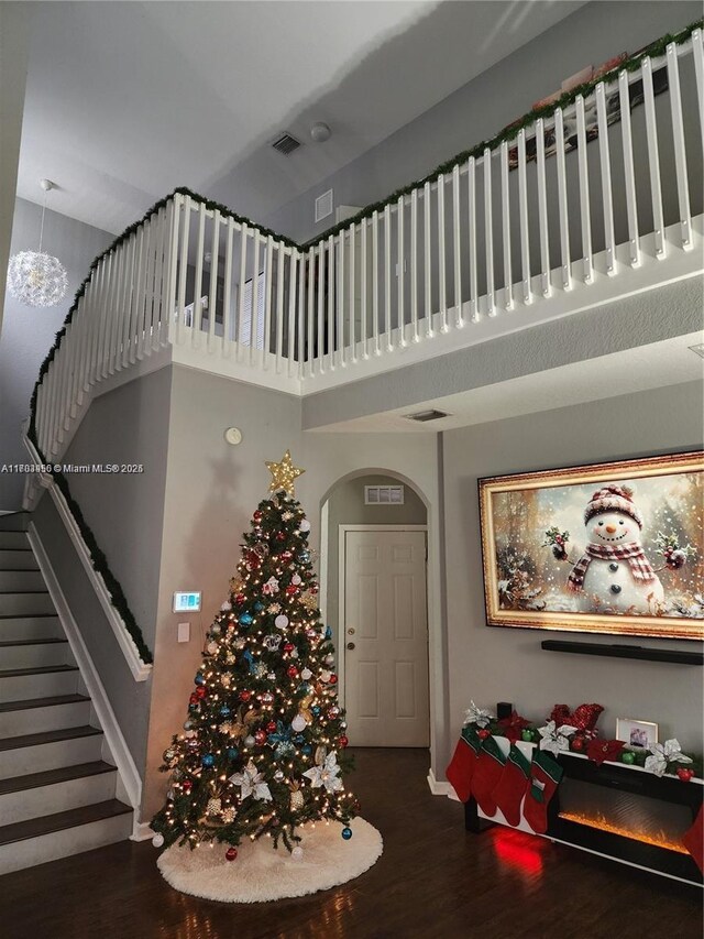 229 NE 36th Ter, Homestead, FL 33033 - entrance foyer featuring wood finished floors, arched walkways, a high ceiling, and stairs