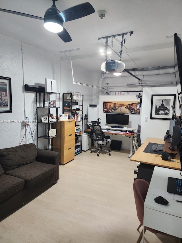 office space featuring ceiling fan and hardwood / wood-style flooring