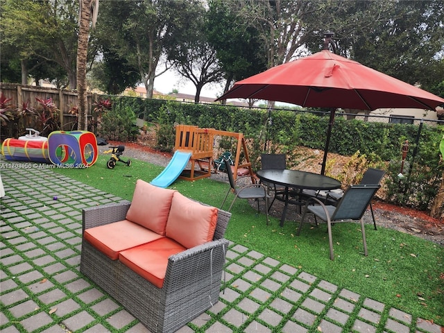 view of patio / terrace featuring an outdoor hangout area and a playground