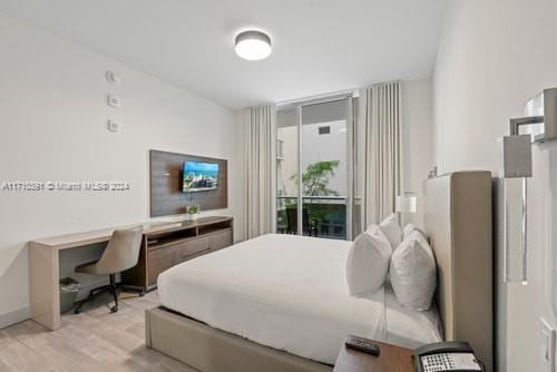 bedroom with light wood-type flooring