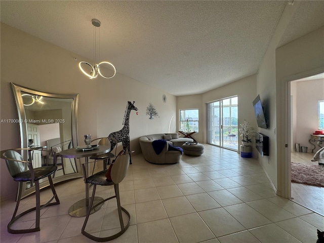 living room with light tile patterned flooring and a textured ceiling