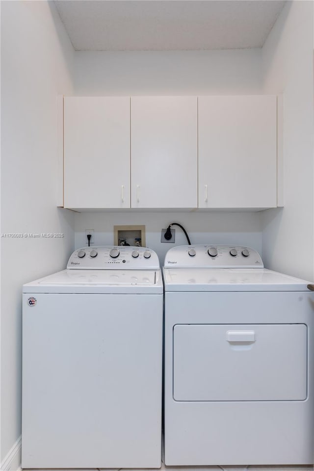 laundry area featuring cabinets and independent washer and dryer