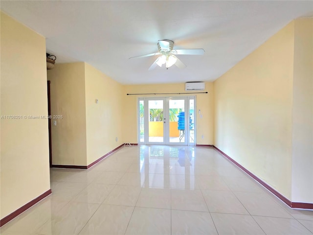 spare room featuring ceiling fan, a wall mounted AC, light tile patterned floors, and french doors