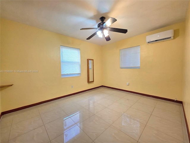 tiled spare room with ceiling fan and a wall mounted AC