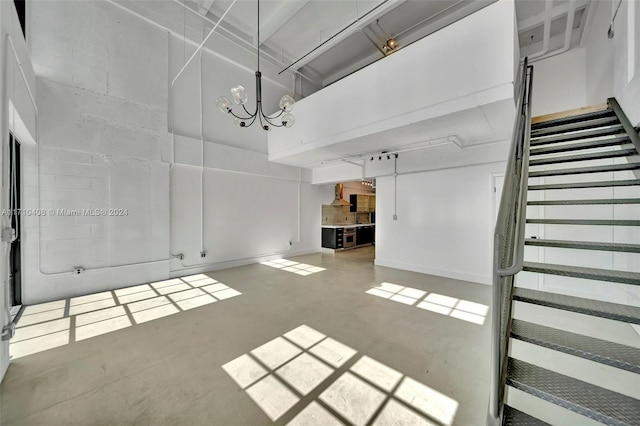 unfurnished living room with concrete flooring