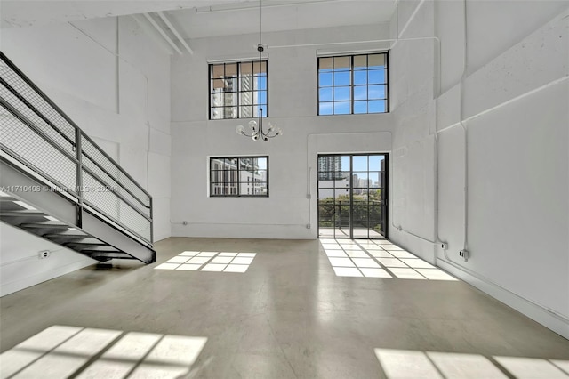 foyer featuring a high ceiling and a chandelier