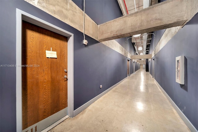 corridor featuring concrete flooring