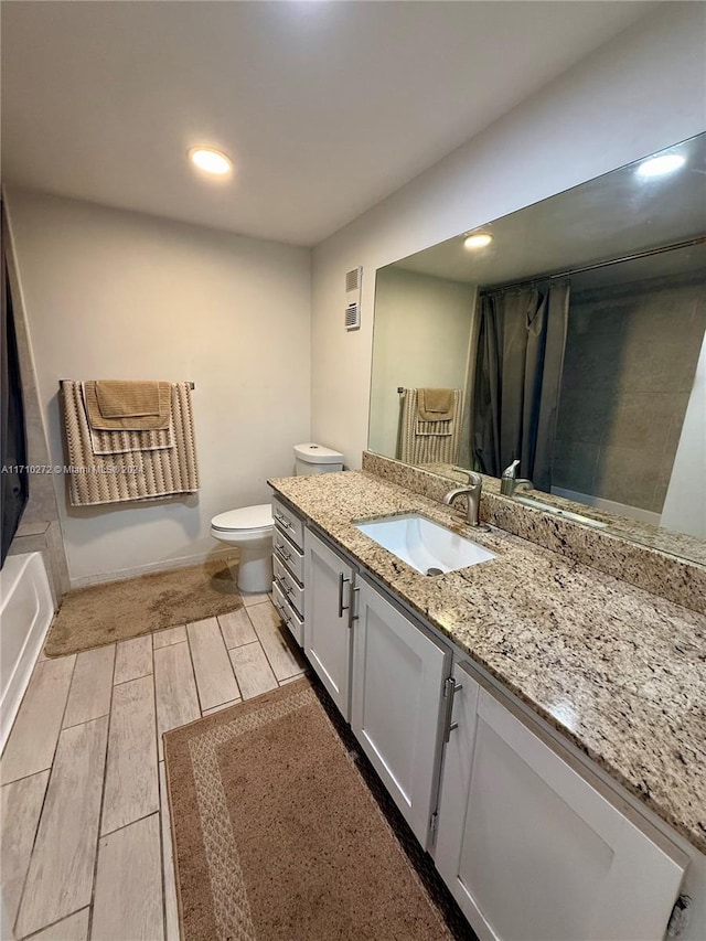 full bathroom featuring shower / bathtub combination with curtain, vanity, toilet, and wood-type flooring