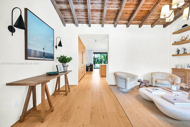 hall featuring beamed ceiling, light wood-type flooring, and wood ceiling