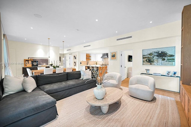 living room with light hardwood / wood-style floors