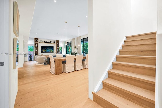 stairway featuring hardwood / wood-style flooring