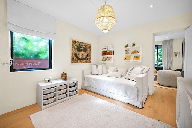 bedroom with light hardwood / wood-style floors