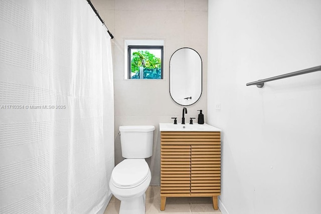 bathroom featuring tile patterned flooring, vanity, toilet, and a shower with shower curtain