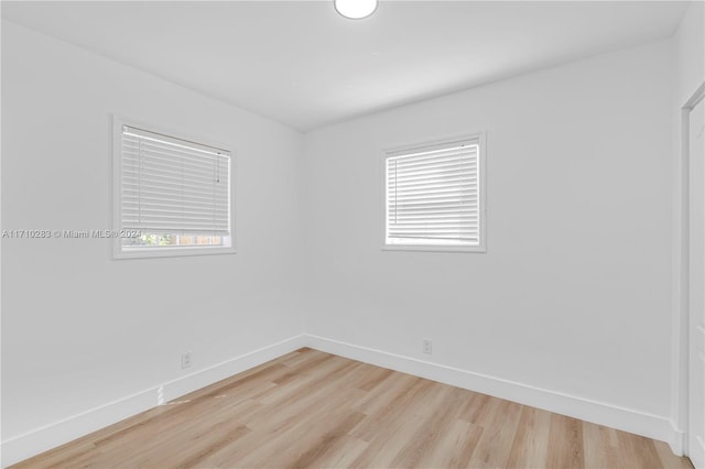 unfurnished room featuring hardwood / wood-style floors