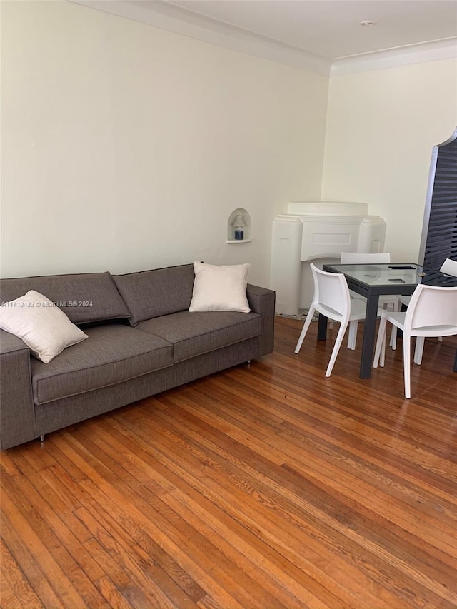 living room featuring hardwood / wood-style floors and ornamental molding