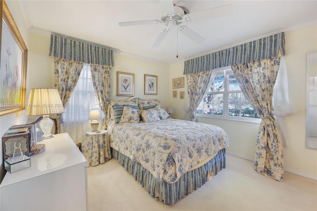 bedroom with ornamental molding, light carpet, and ceiling fan