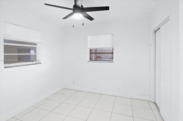 bathroom with hardwood / wood-style flooring, vanity, toilet, and a tile shower