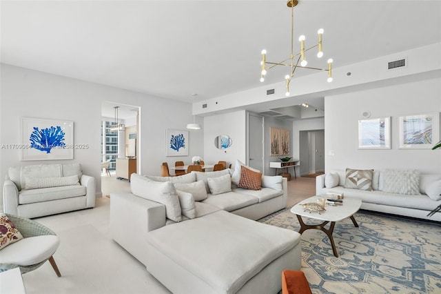 living room with an inviting chandelier